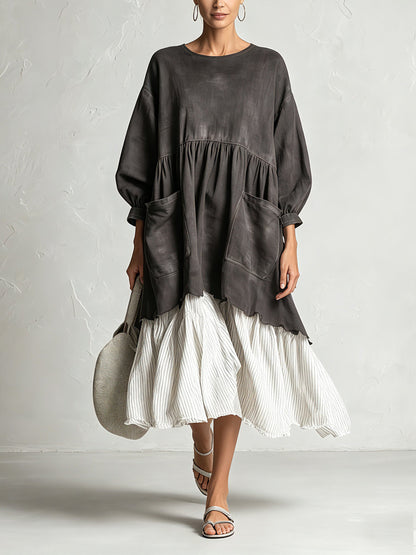 Oversized charcoal midi dress with pleated ivory hem